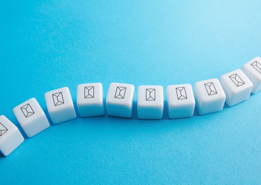 A string of white cubes with email icons, representing an email sequence.